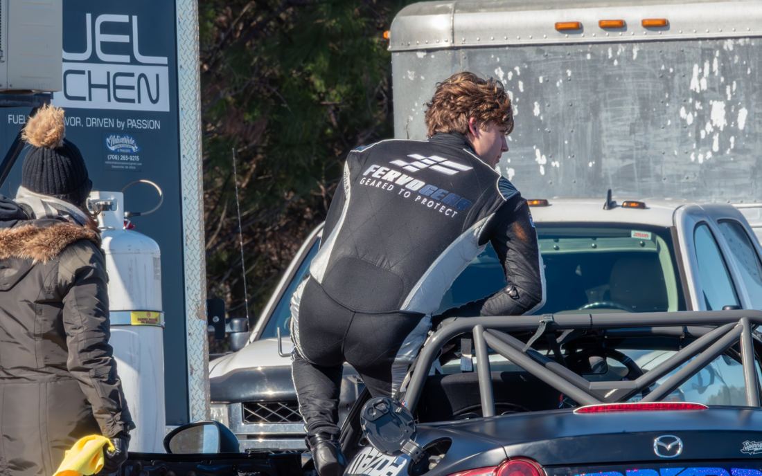 Carsten climbing into the MX-5 Cup car